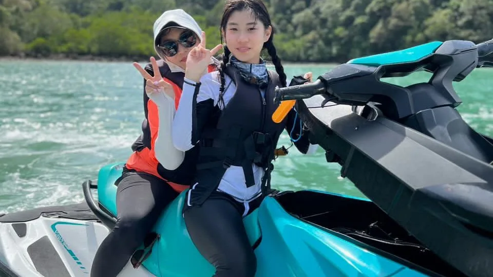 Two riders on a turquoise jet ski in Alyna’s tour gallery